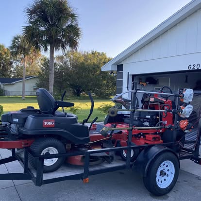 A1 Moto Gravely and Toro commercial lawn equipment loaded on trailer, Fort Pierce FL