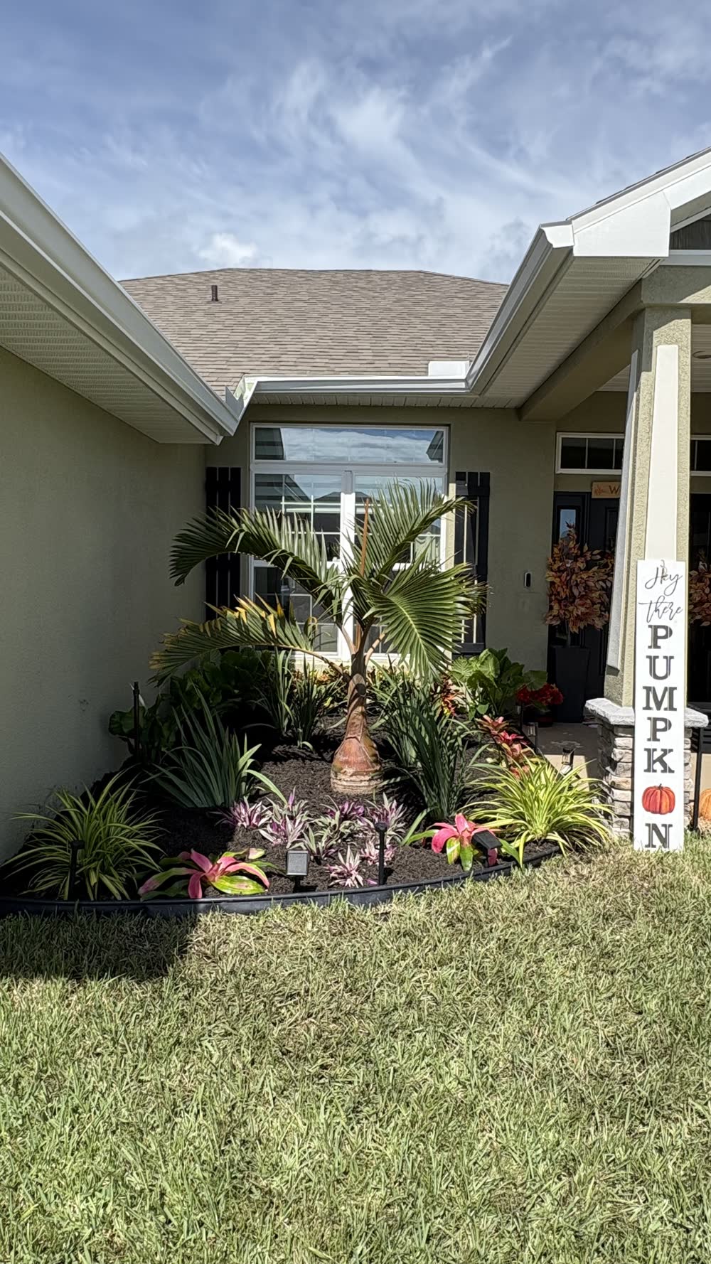 Fresh tropical landscape bed installed by A1 Moto at a Fort Pierce home entrance